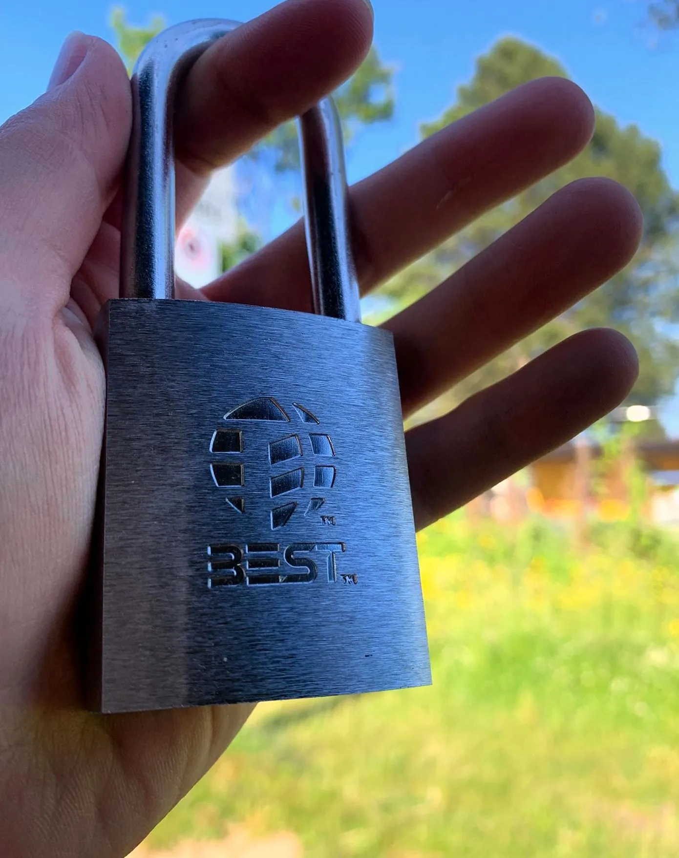 Locksmith holding a new steel padlock in Las Vegas